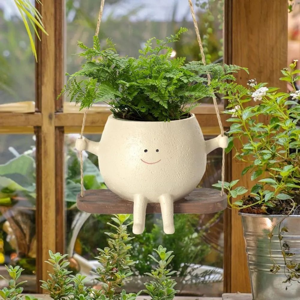 Swing face planter